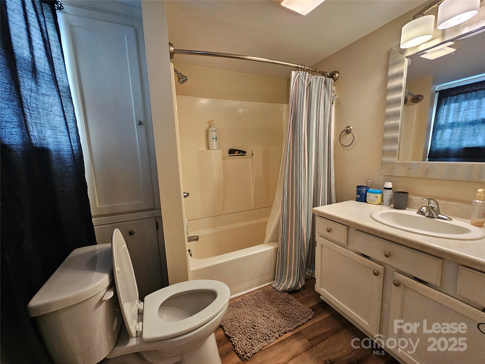 208 West Main Street Lawndale, NC 28090 - Photo 13 of 15 a bathroom with a toilet a sink and shower