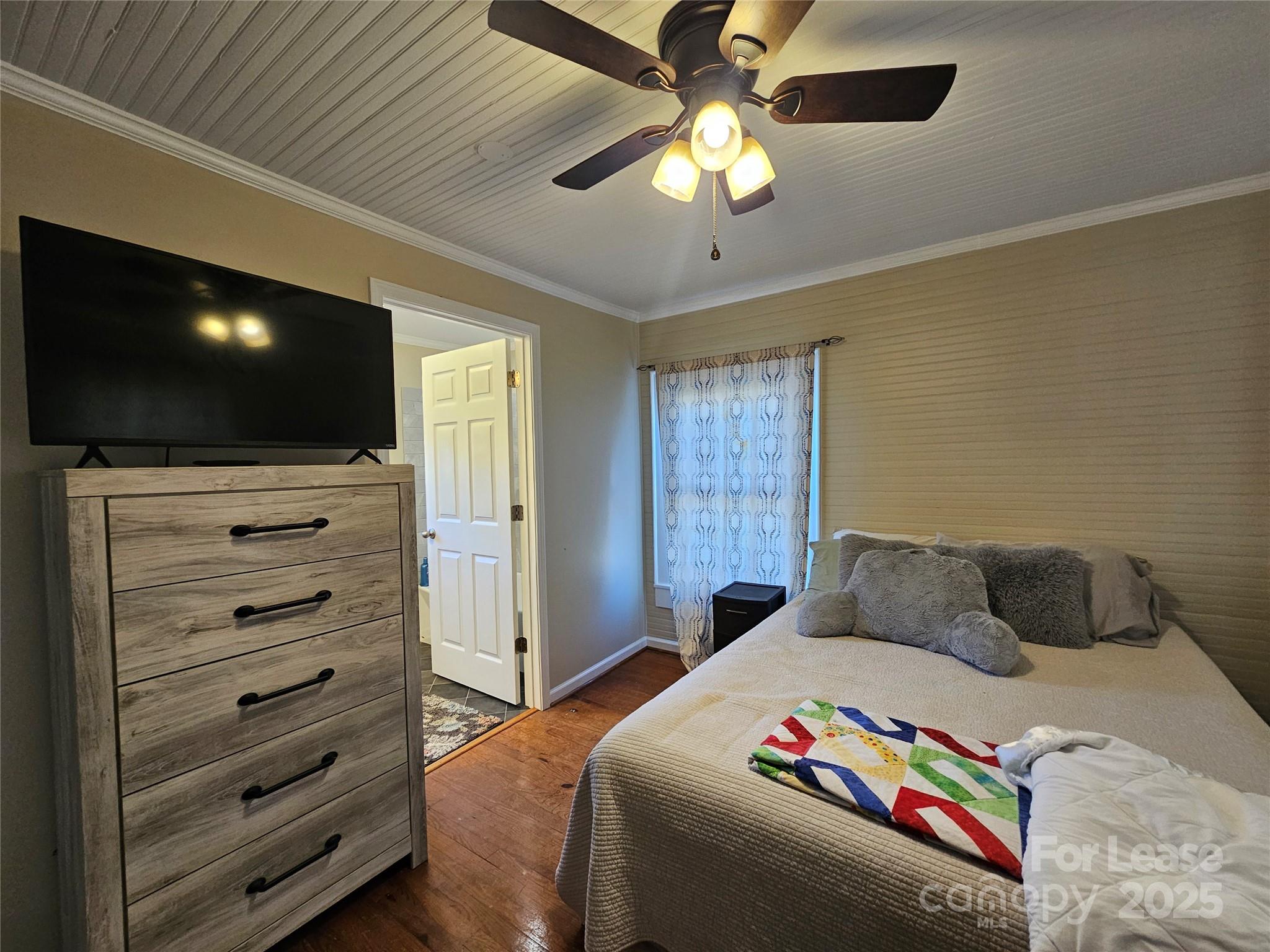 208 West Main Street Lawndale, NC 28090 - Photo 8 of 15 a bedroom with a bed and a flat screen tv