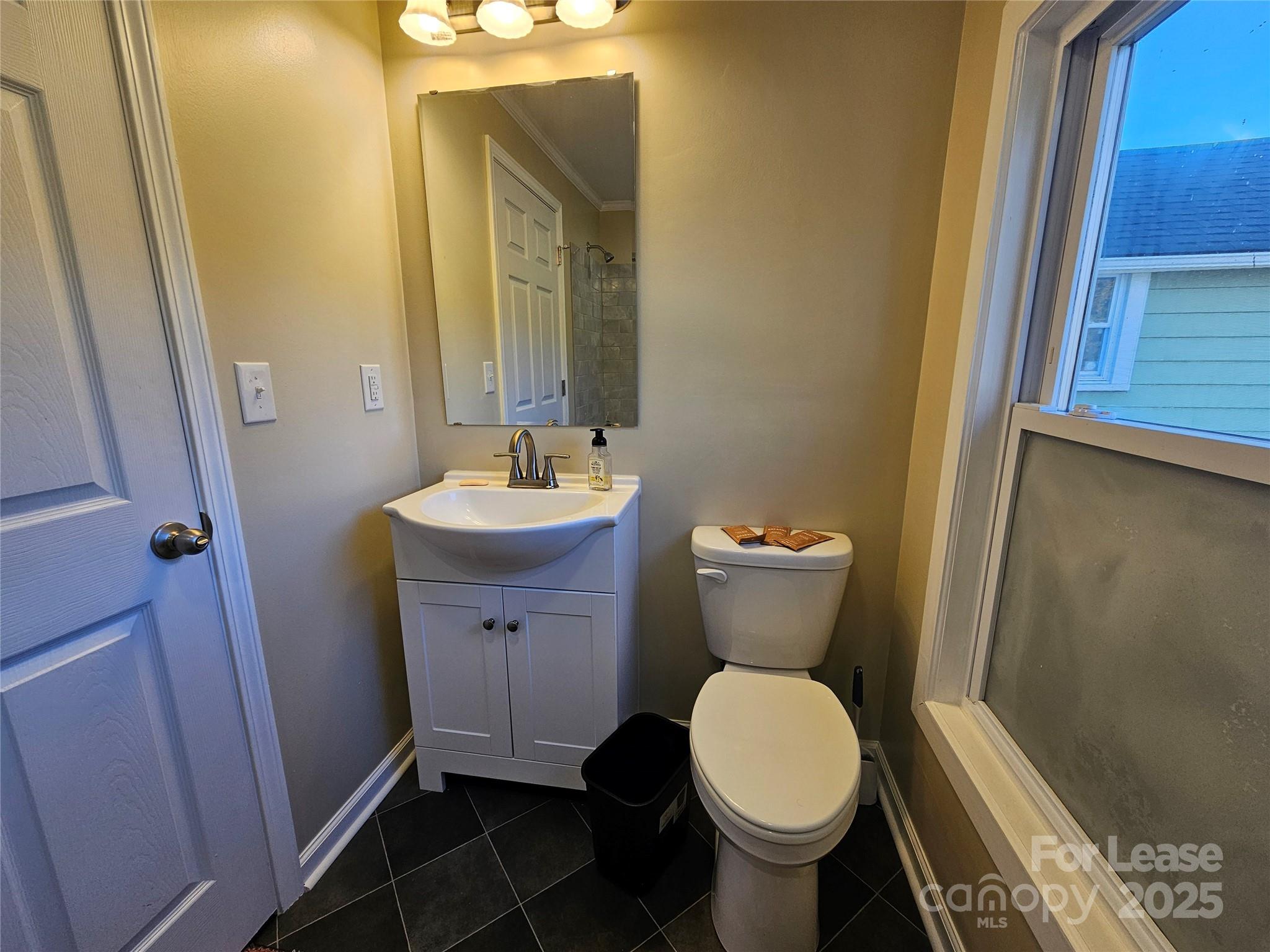 208 West Main Street Lawndale, NC 28090 - Photo 9 of 15 a bathroom with a toilet sink and mirror