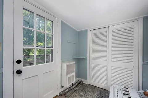 a view of a room that has a window in it
