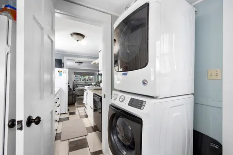 a view of a hallway with washer and dryer