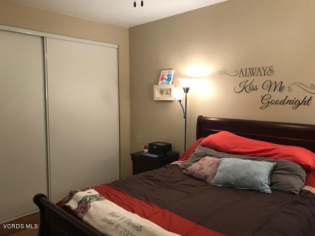 2381 Archwood Lane, Unit 184 Simi Valley, CA 93063 - Photo 13 of 33 a bedroom with a bed and a window
