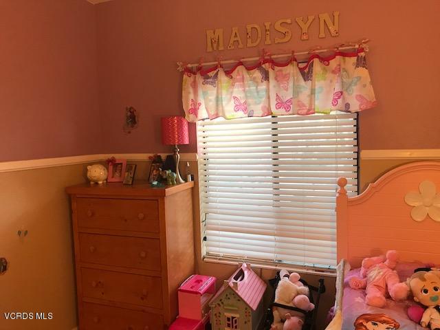 2381 Archwood Lane, Unit 184 Simi Valley, CA 93063 - Photo 15 of 33 a view of a bedroom with a bed and a window