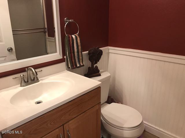 2381 Archwood Lane, Unit 184 Simi Valley, CA 93063 - Photo 19 of 33 a bathroom with a sink a toilet and mirror