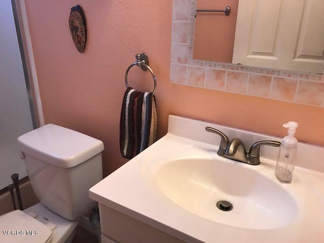 2381 Archwood Lane, Unit 184 Simi Valley, CA 93063 - Photo 20 of 33 a bathroom with a sink and a toilet