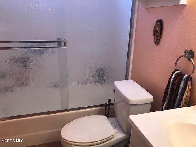 2381 Archwood Lane, Unit 184 Simi Valley, CA 93063 - Photo 21 of 33 a white toilet and a shower curtain