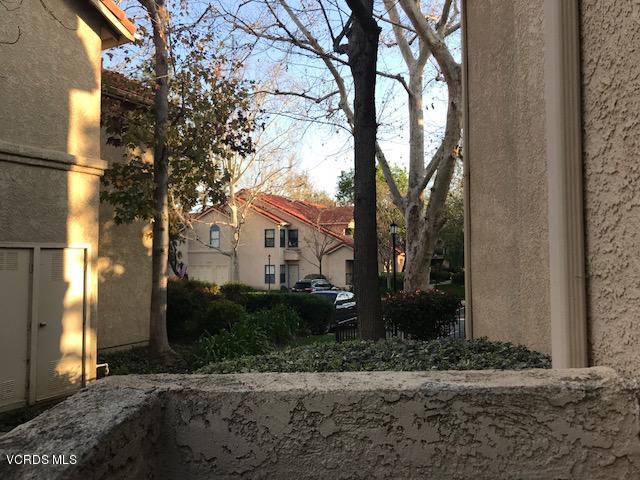 2381 Archwood Lane, Unit 184 Simi Valley, CA 93063 - Photo 24 of 33 a tree in front of a house