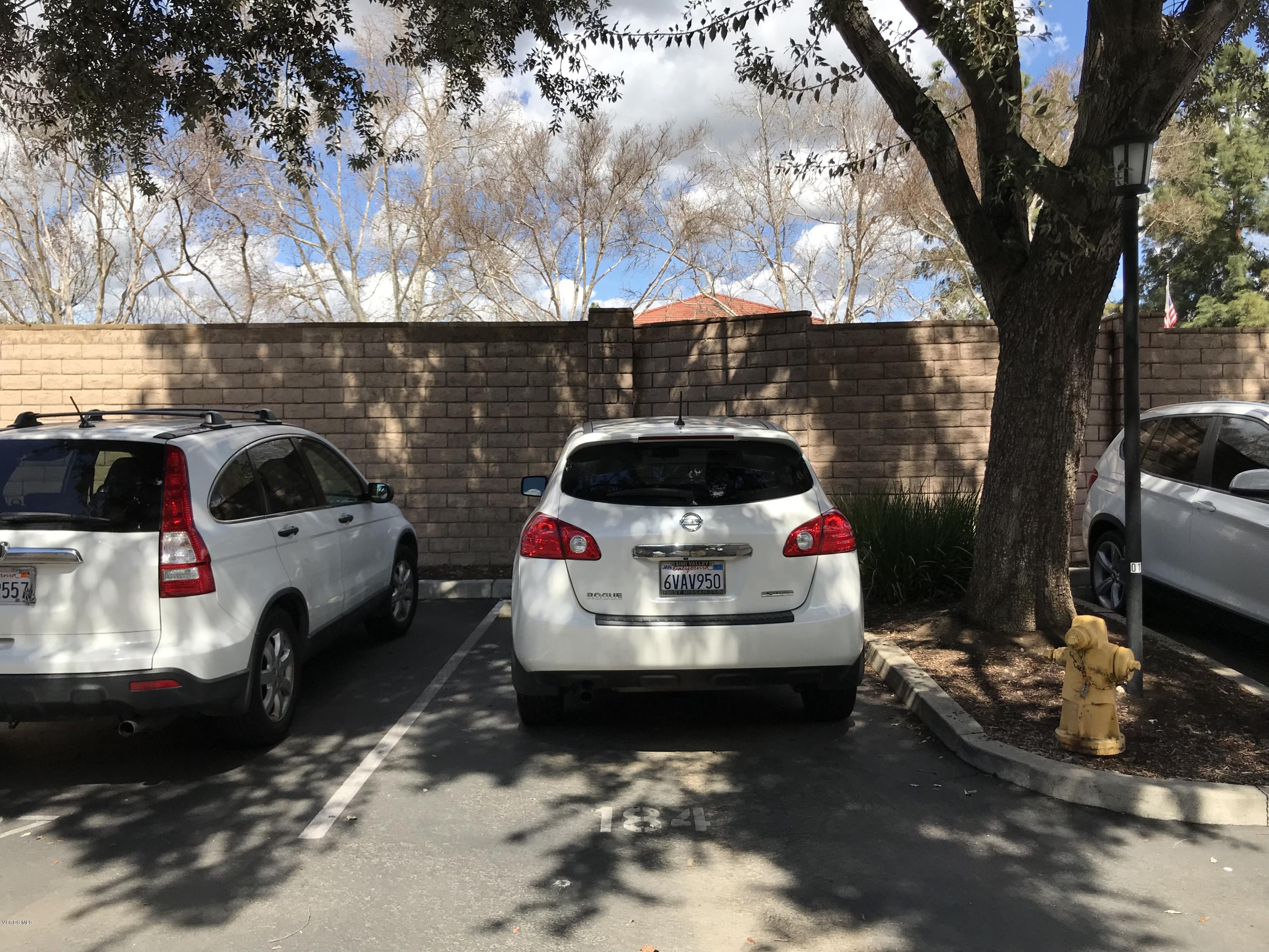 2381 Archwood Lane, Unit 184 Simi Valley, CA 93063 - Photo 29 of 33 a car parked in a parking lot