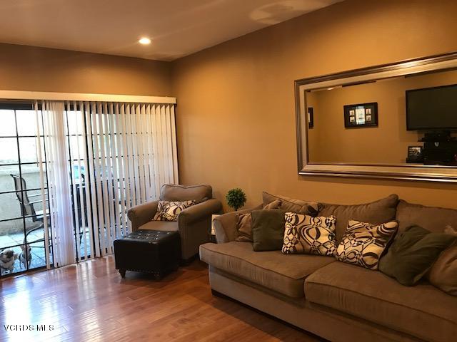 2381 Archwood Lane, Unit 184 Simi Valley, CA 93063 - Photo 4 of 33 a living room with furniture and a flat screen tv