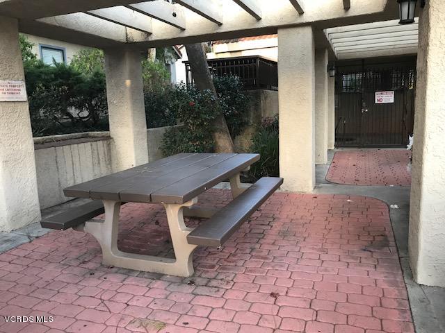 2381 Archwood Lane, Unit 184 Simi Valley, CA 93063 - Photo 31 of 33 a view of a porch with furniture and floor to ceiling window