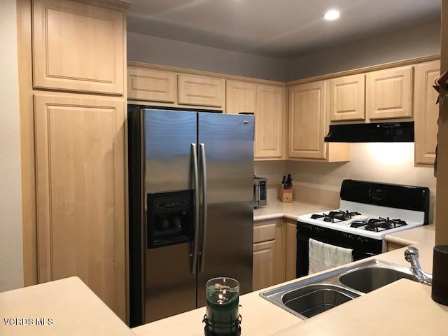 2381 Archwood Lane, Unit 184 Simi Valley, CA 93063 - Photo 8 of 33 a kitchen with stainless steel appliances granite countertop a refrigerator and a stove top oven