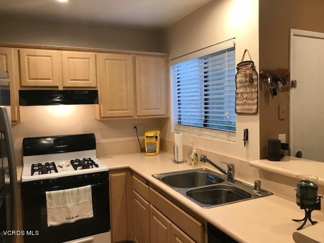 2381 Archwood Lane, Unit 184 Simi Valley, CA 93063 - Photo 9 of 33 a kitchen with a sink stove and cabinets