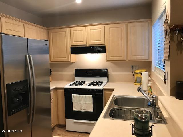 2381 Archwood Lane, Unit 184 Simi Valley, CA 93063 - Photo 10 of 33 a kitchen with a stove and a refrigerator