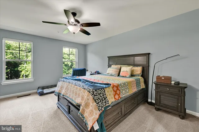 a bed room with a bed and a window