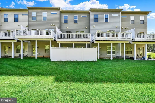 a front view of house with yard and outdoor seating