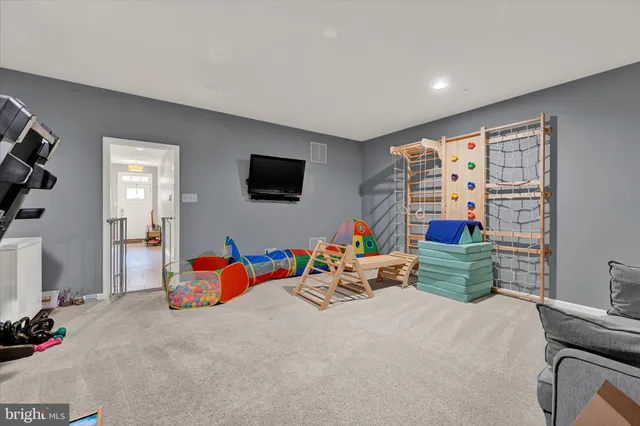 a room with furniture and a flat screen tv