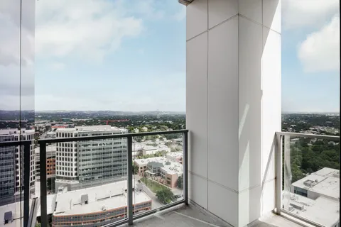 a view of a balcony with city view