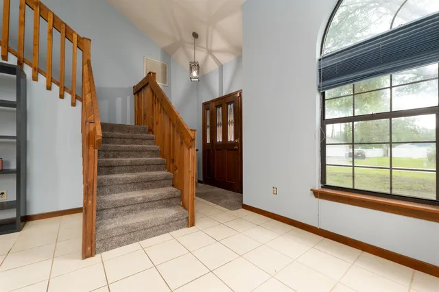 a view of backyard of house with garage