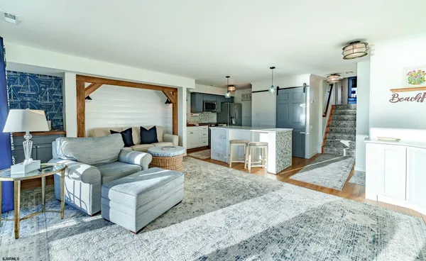 a living room with furniture and a rug