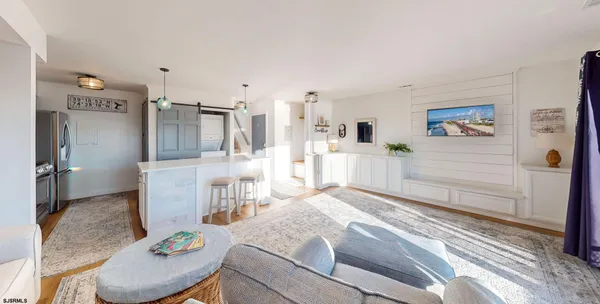 a living room with furniture and a table