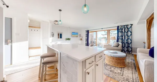 a very nice looking room with a large window and furniture