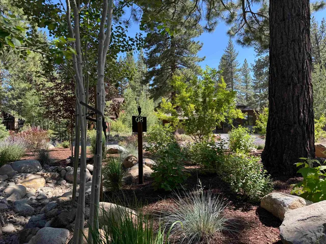a view of a backyard of a house with a yard