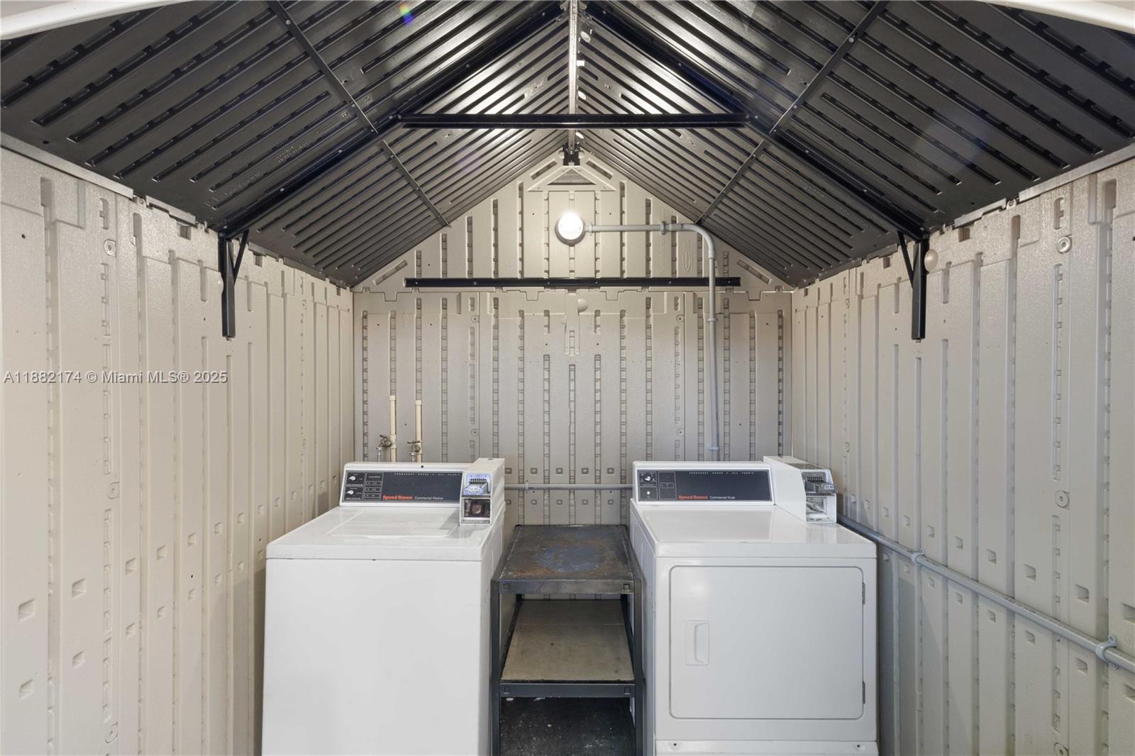 1408 Southwest 19th Terrace, Unit 1410 Miami, FL 33145 - Photo 11 of 12 a utility room with dryer and washer