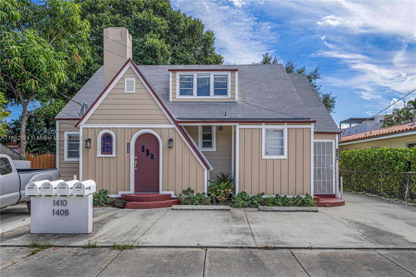 1408 Southwest 19th Terrace, Unit 1410 Miami, FL 33145 - Photo 12 of 12 a front view of a house with garden