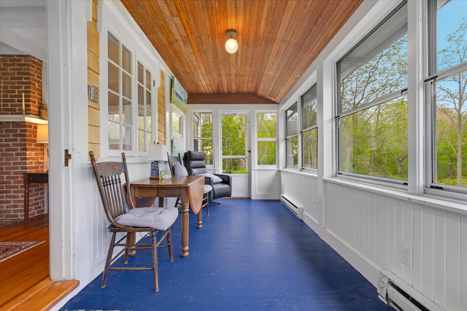 21 Quaker Road East Sandwich, MA 02537 - Photo 22 of 43 a dining room with furniture a chandelier and wooden floor