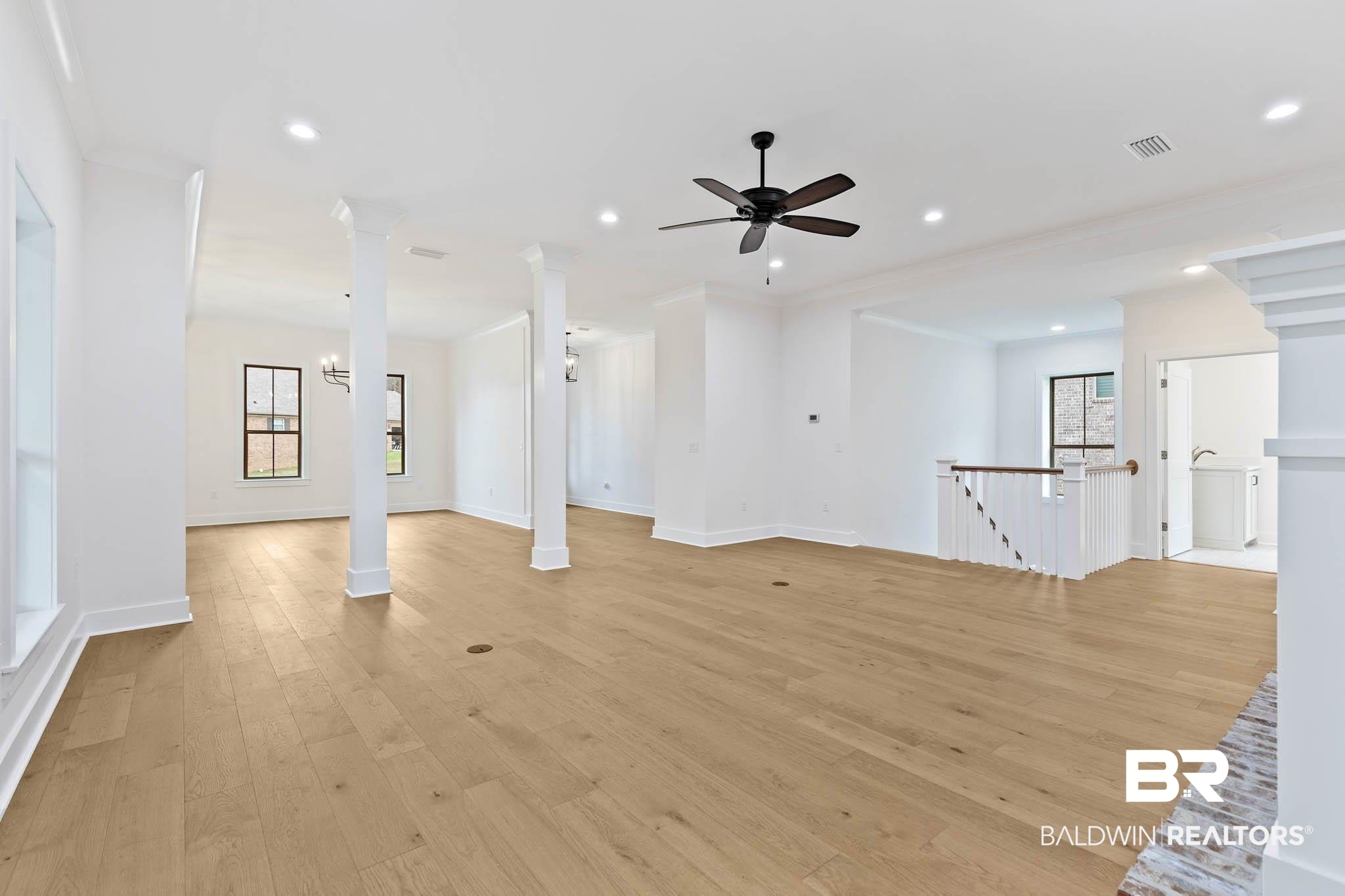 6656 Garrison Drive Daphne, AL 36527 - Photo 19 of 57 Unfurnished living room with light wood-type flooring, ornamental molding, ceiling fan, and recessed lighting