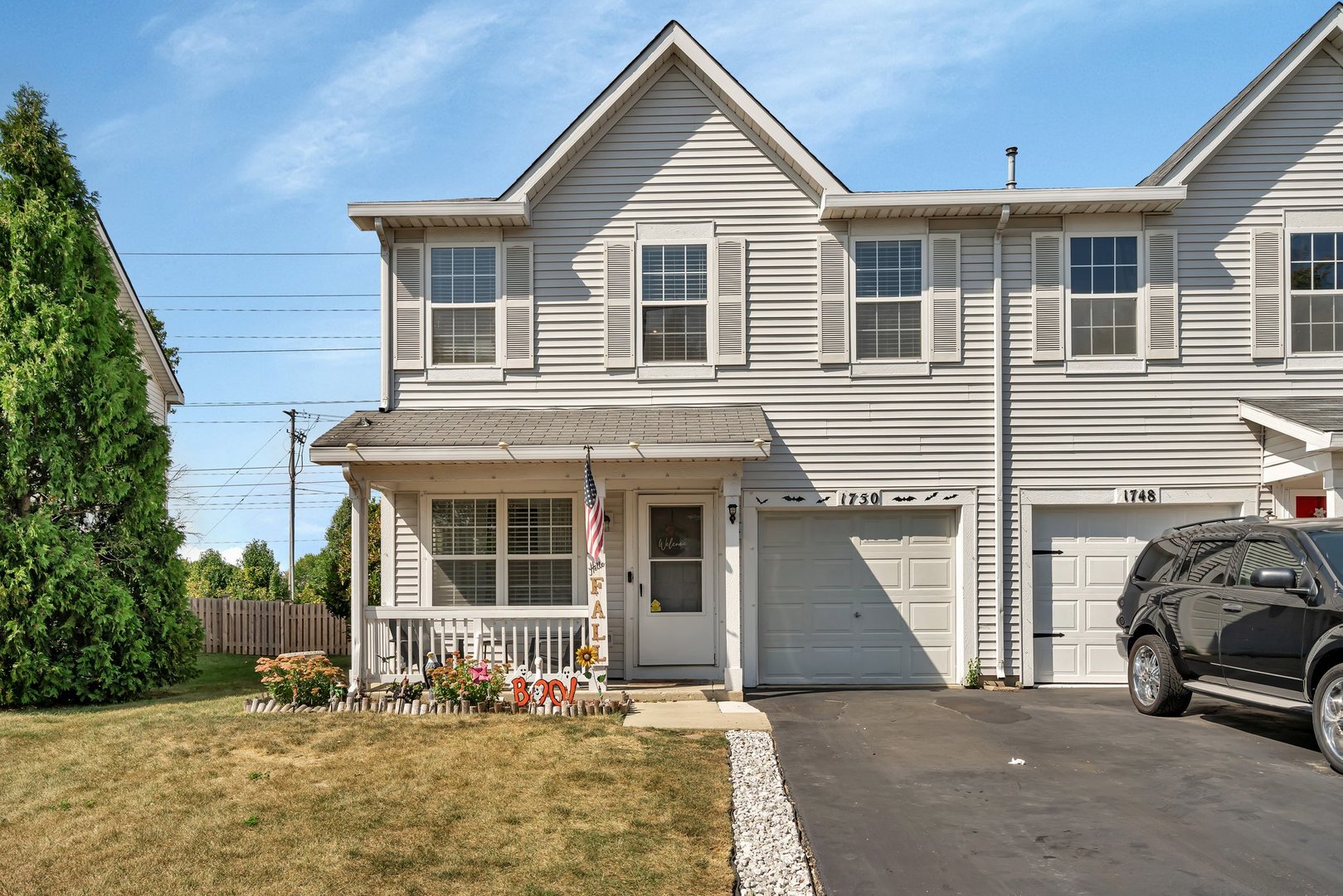 1750 Raleigh Trail Romeoville, IL 60446 - Photo 36 of 39 a front view of a house with a yard outdoor seating and garage
