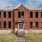 a front view of a house with yard