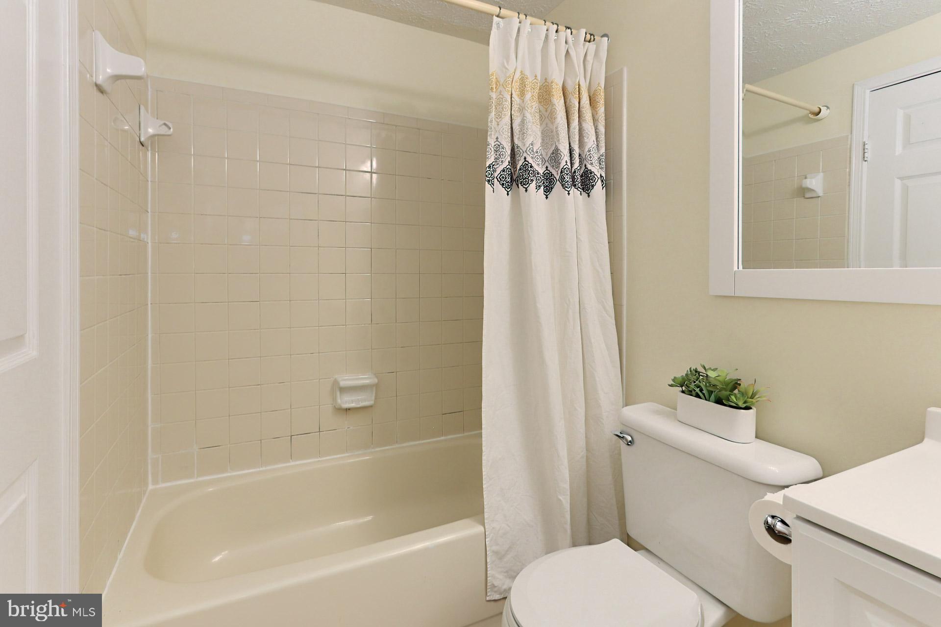 11004 Granby Court Reston, VA 20191 - Photo 16 of 33 Tub/Shower + new toilet & medicine cabinet