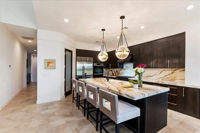 a kitchen with counter top space a sink and cabinets