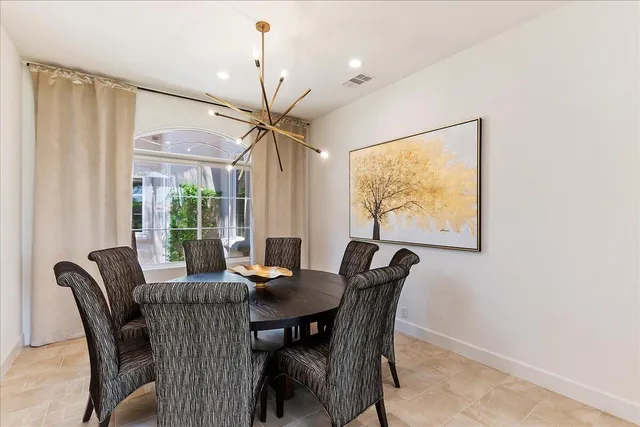 a bathroom with a granite countertop sink a toilet and a mirror