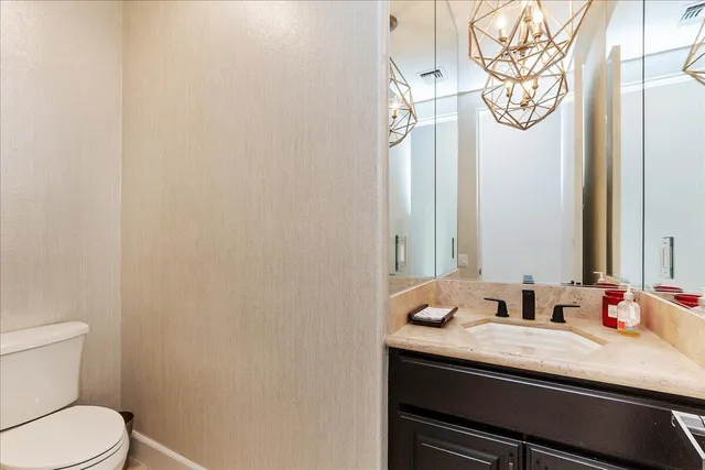 a spacious bedroom with a bed and a fireplace