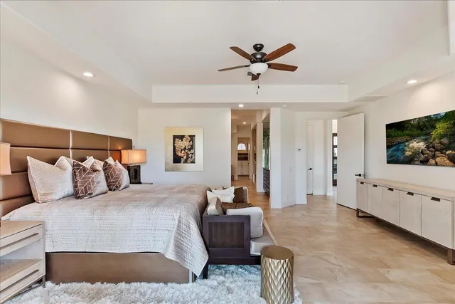 a large kitchen with kitchen island a sink a counter space and stainless steel appliances