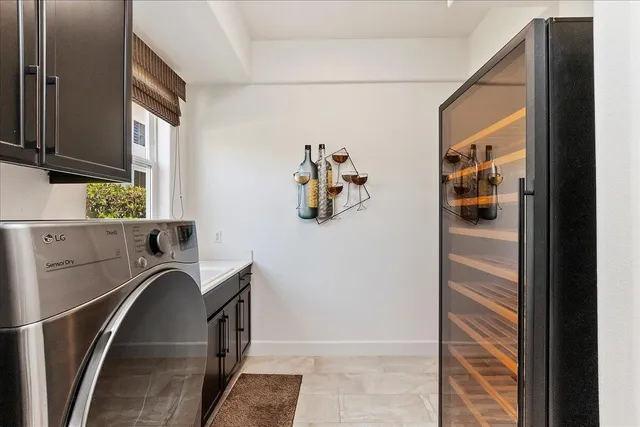 a view of a patio with a table chairs and backyard