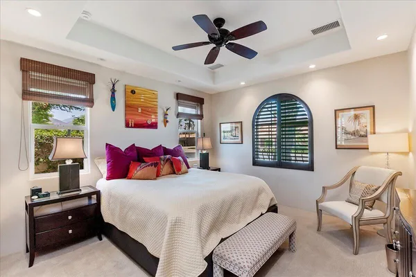 a bedroom with a bed a desk and chair