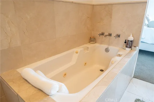 a bathroom with a bathtub and shower