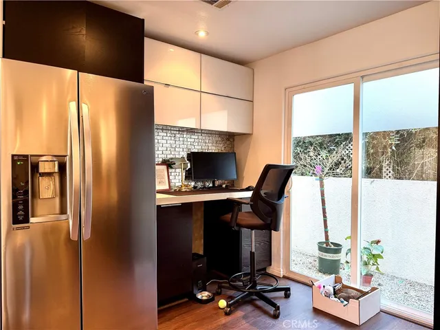 a work room with furniture and a window