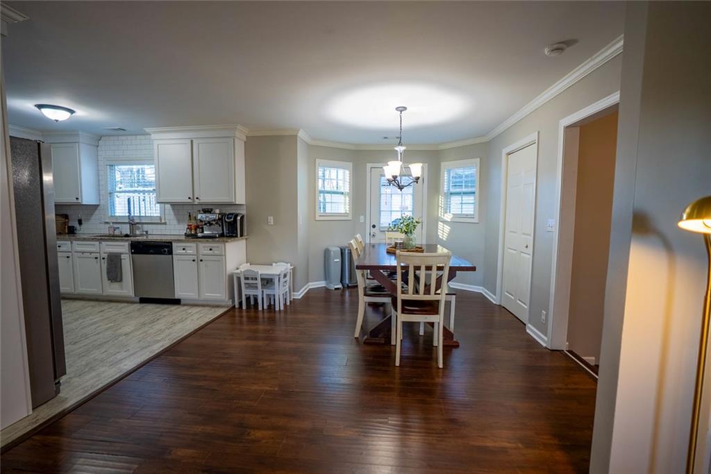 707 Reese Street Monroe, GA 30655 - Photo 16 of 61 a view of a dining room with furniture window and wooden floor