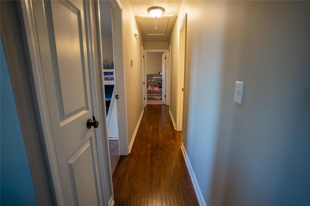 707 Reese Street Monroe, GA 30655 - Photo 21 of 61 a view of a hallway with wooden floor
