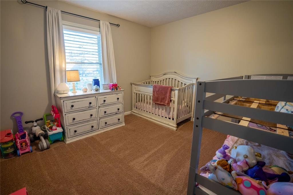 707 Reese Street Monroe, GA 30655 - Photo 22 of 61 a bed room with a bed and a window