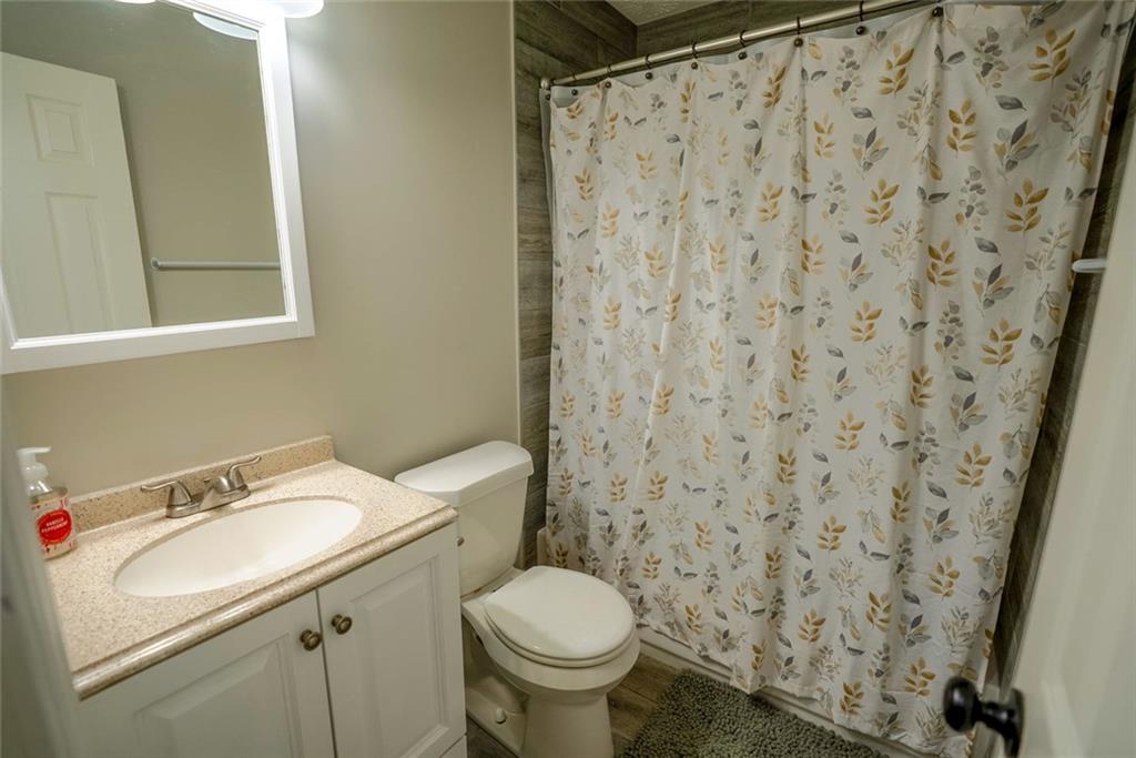 707 Reese Street Monroe, GA 30655 - Photo 25 of 61 a bathroom with a sink and a toilet