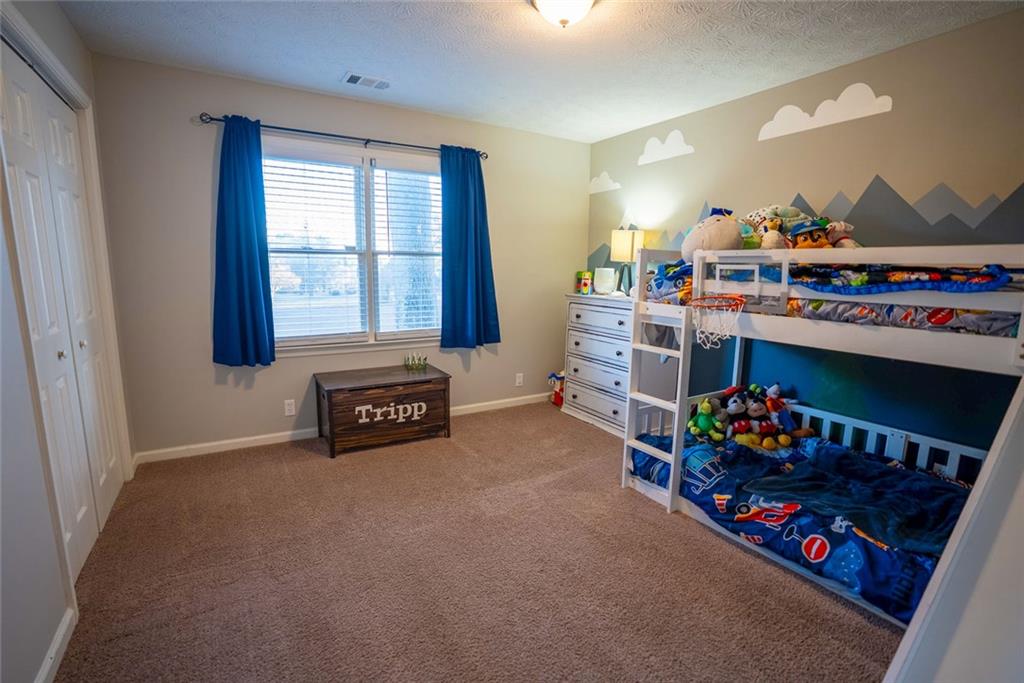 707 Reese Street Monroe, GA 30655 - Photo 27 of 61 a room with toys and a filled with furniture
