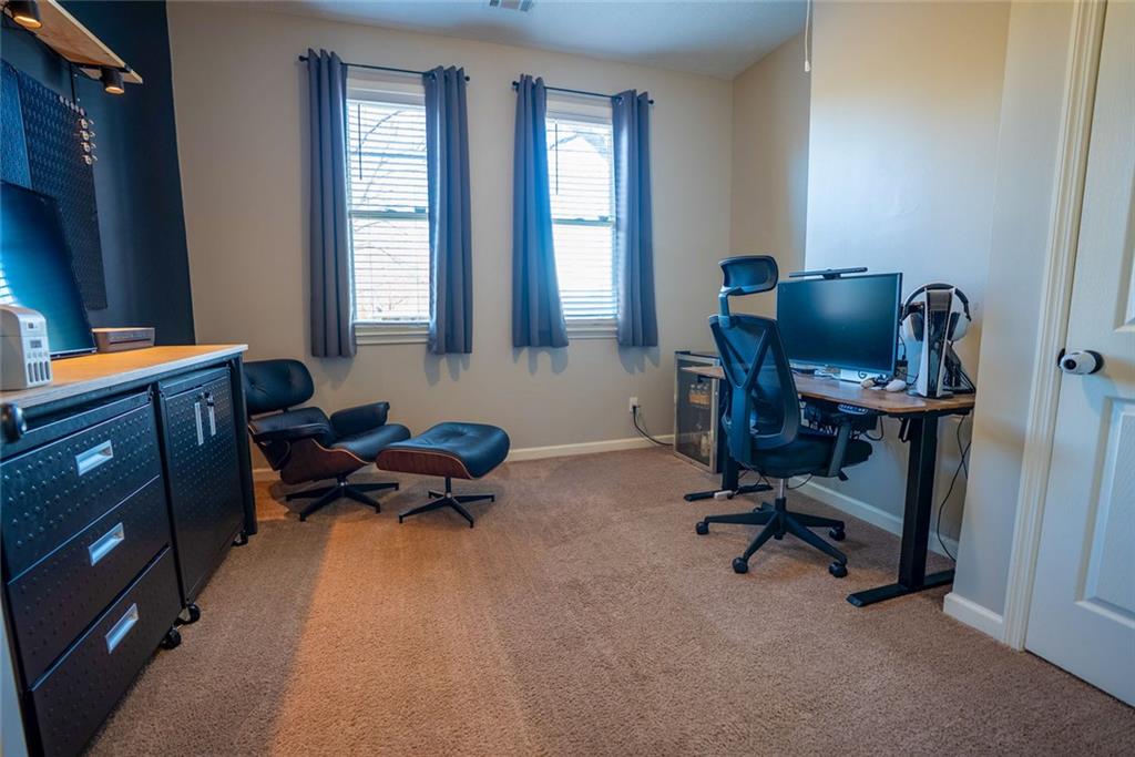 707 Reese Street Monroe, GA 30655 - Photo 32 of 61 a livingroom with workspace and a window