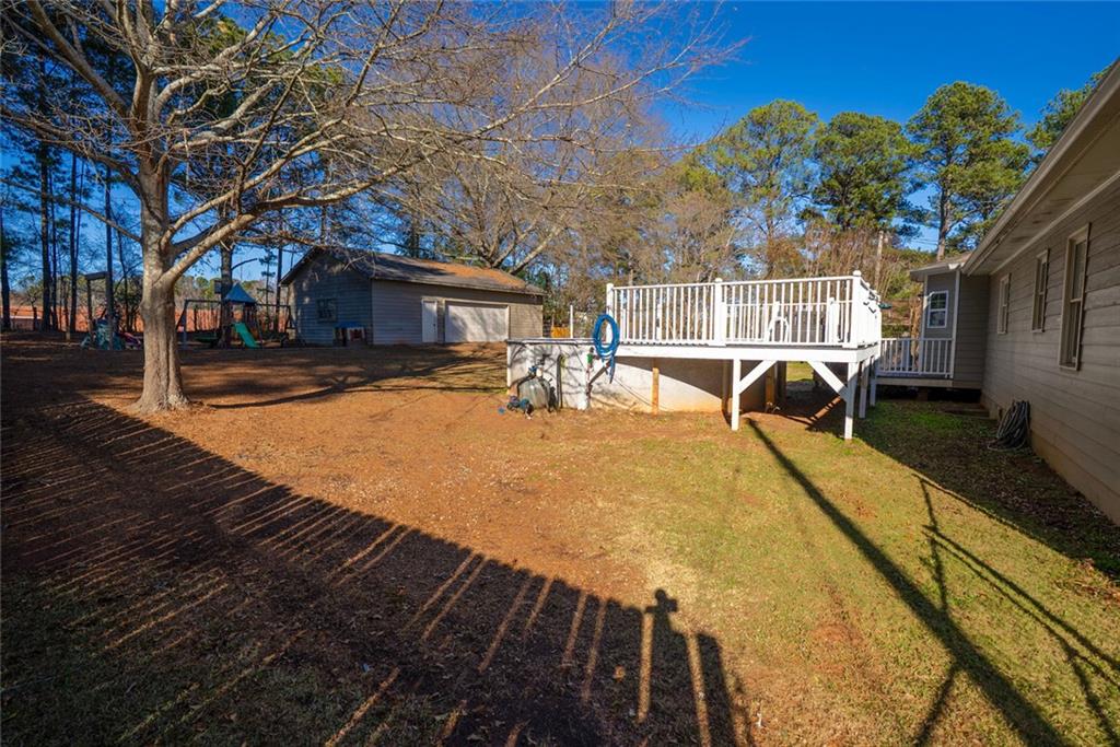 707 Reese Street Monroe, GA 30655 - Photo 53 of 61 a view of a swimming pool with a patio