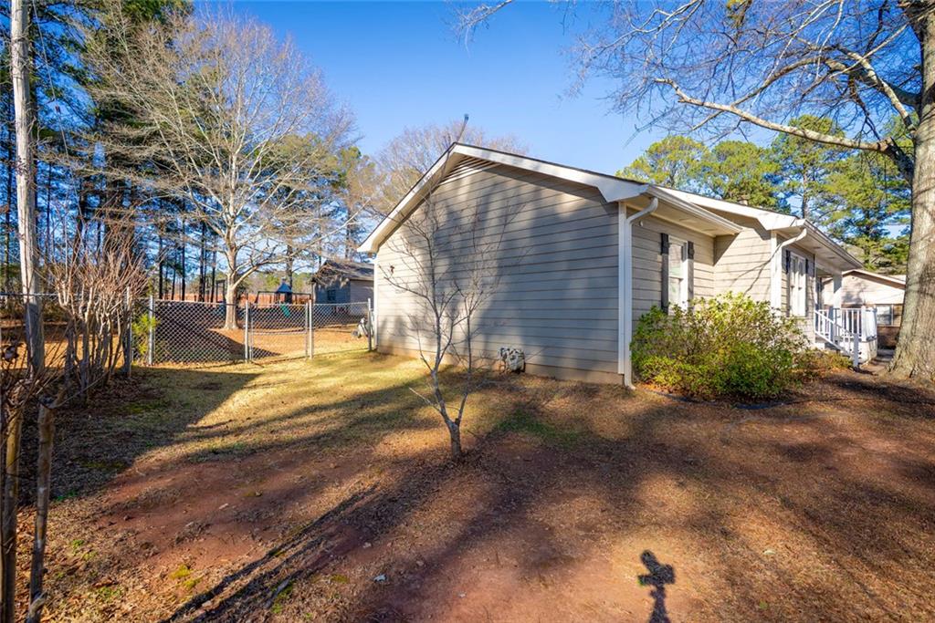 707 Reese Street Monroe, GA 30655 - Photo 54 of 61 a view of backyard of a house