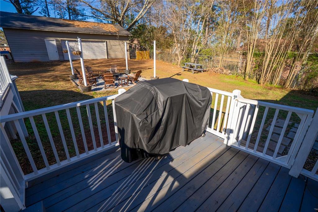 707 Reese Street Monroe, GA 30655 - Photo 57 of 61 a view of balcony with wooden floor and outdoor seating